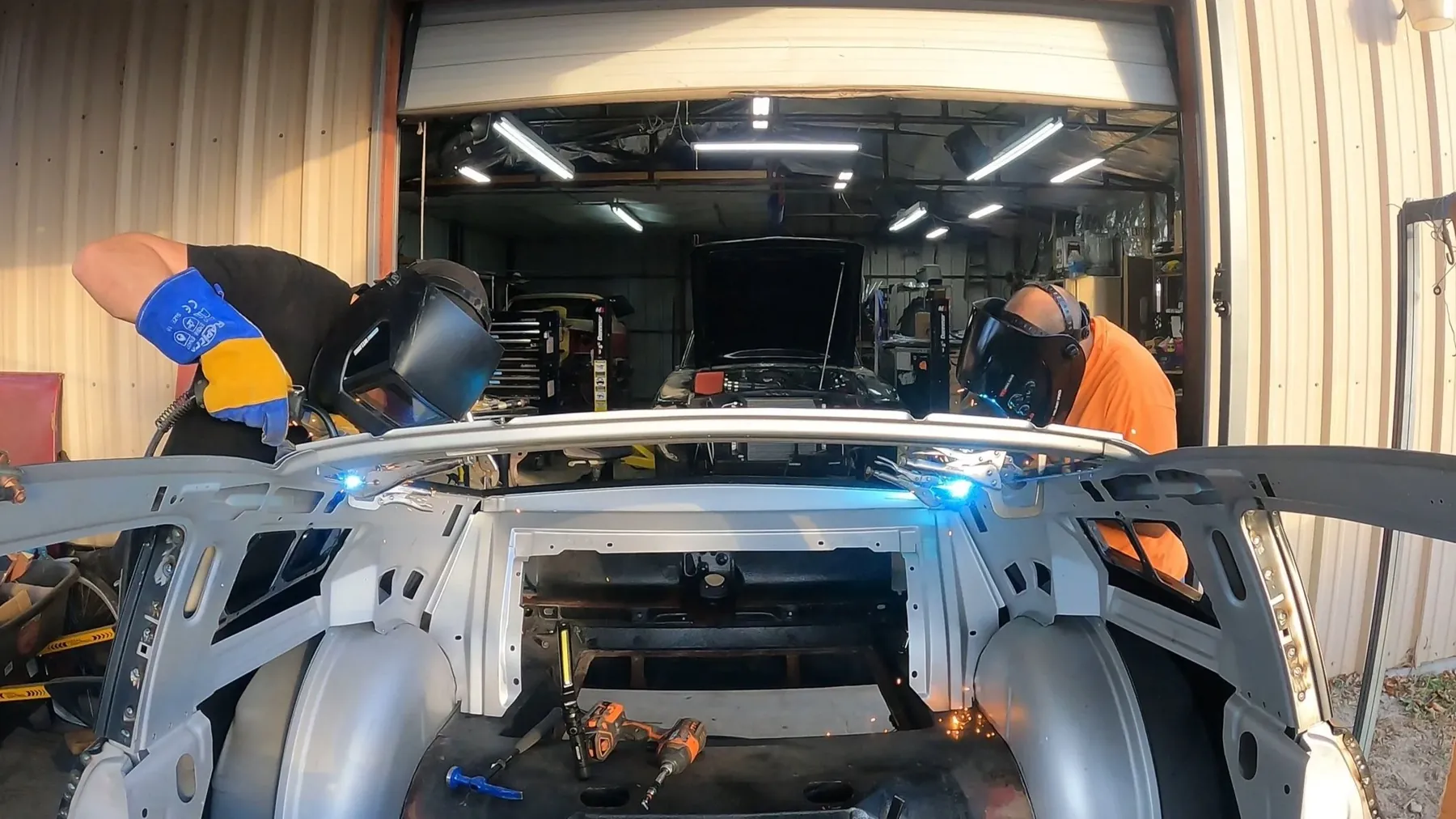 Welding at the front of a Mustang shell during the suspension swap.